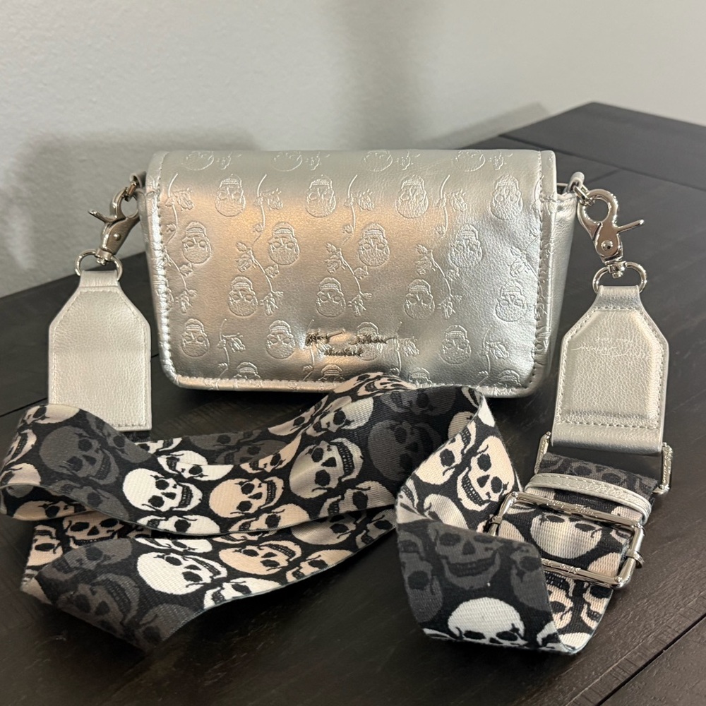 Betsey Johnson Metallic Silver Crossbody Bag with Skull-Print Strap